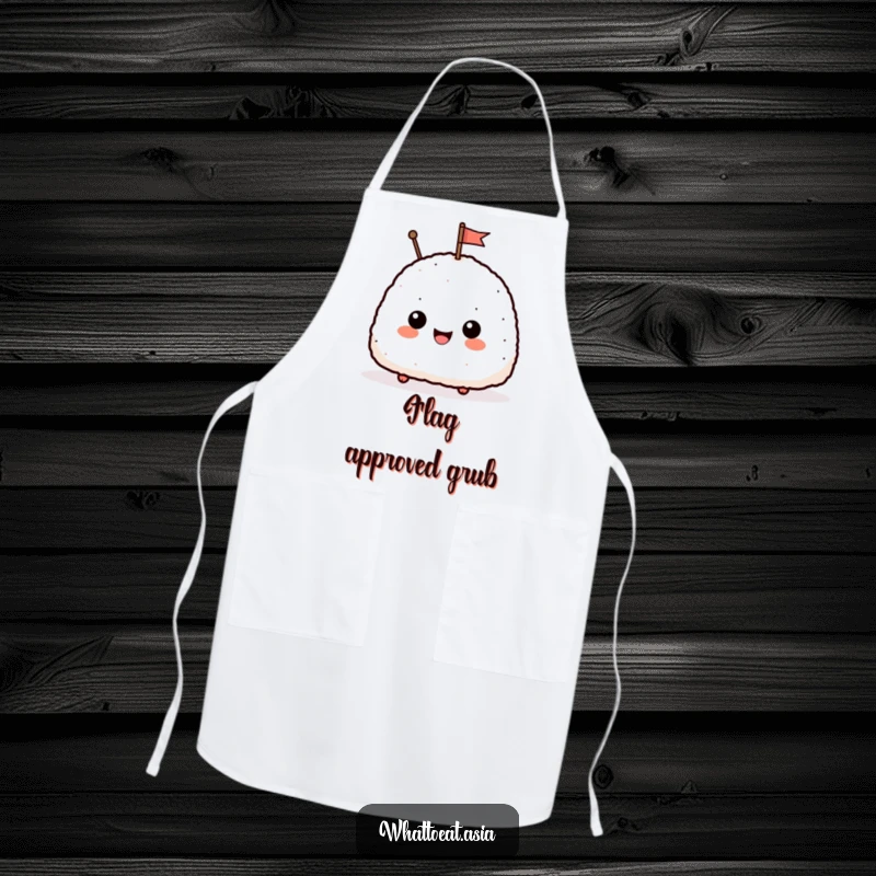 Funny apron depicting a happy onigiri with a small smile, waving a tiny flag, ideal for cooking and baking with a humorous twist.